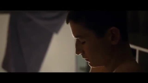 Seductive cougar MILF seduces young muscular stud in dim light
