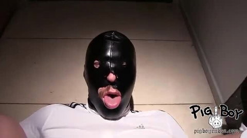Man in black leather hood with tongue out, adidas shirt, Evil Angel cumslut preview