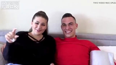 Pretty brunette and handsome stud smiling on bed, big tits tease