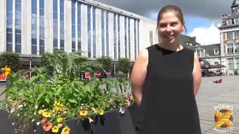 Smiling MILF Alice in black dress at French public square