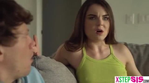 Step sis in green tank top shocked as guy touches her on couch