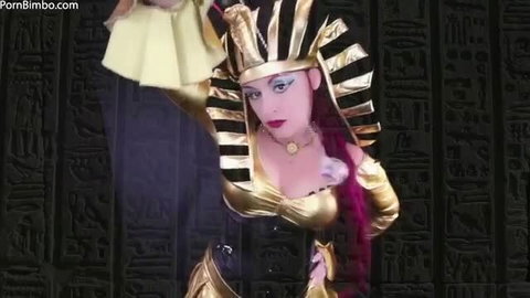 Jade Paris as sexy Egyptian queen in gold costume, teasing denial