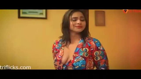 Indian busty babe in deep cleavage printed dress smiling seductively