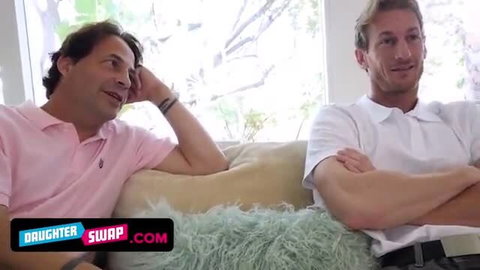 Stepdads Liz and Jenna swap on couch in pink polo shirts