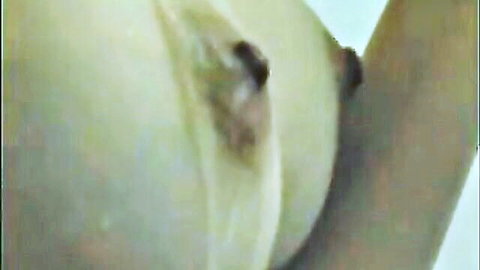 Close-up of pale woman's large breasts with dark nipples, sister-in-law theme