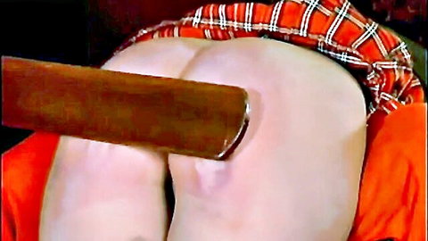 Jasmine bent over for ritual spanking, plaid skirt up exposing ass