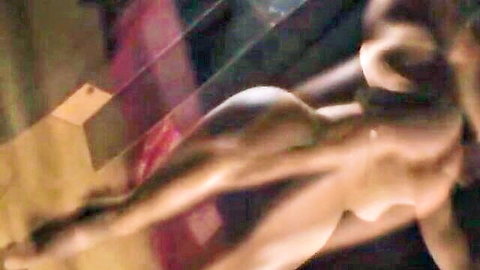 Nude woman with red whip marks on back in BDSM pose