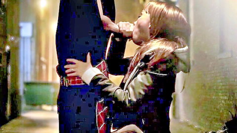 Redhead in fur hood eagerly sucks guy's thick cock in dark alley blowjob