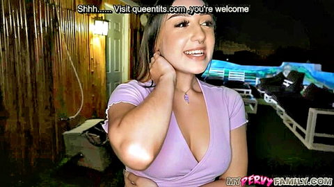 Smiling petite Latina teen with long hair flaunting deep cleavage in tight purple top poolside