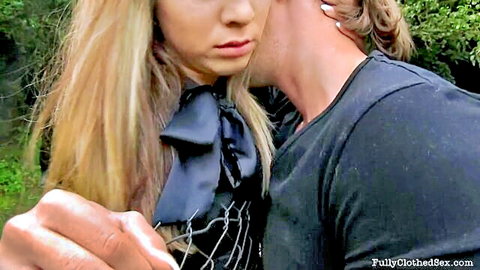 Blonde babe with pouty lips passionately neck kissed by stud outdoors in clothed sex tease