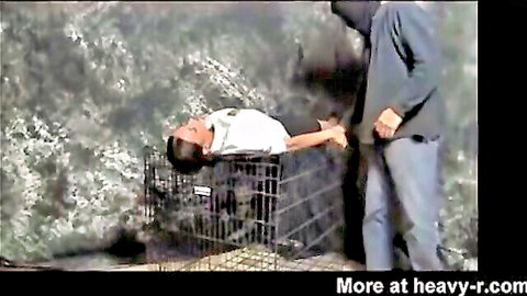 Goldie Blair MILF captured in cage by escaped prisoner, bondage scene