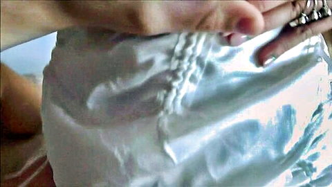 Kate Dee in teasing white satin lingerie close-up, curvy hips and hands