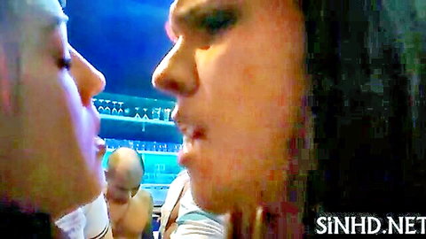 Close-up of couple intimately chatting at raunchy wet party bar