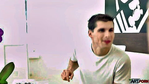 Young Caucasian guy in white t-shirt seductively licks his finger teasingly
