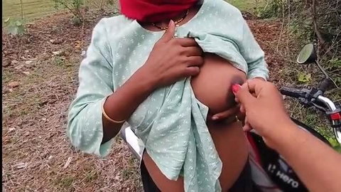 Young Indian Desi College Girl exposes big tits outdoors by motorcycle