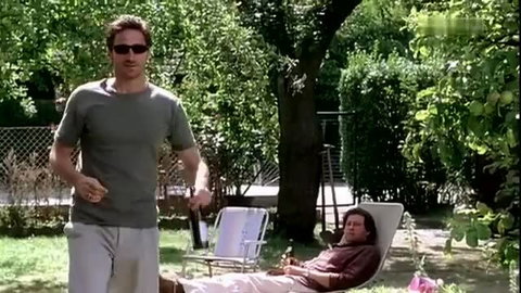Two hot men lounging by pool in shirts and pants, gay thumbnail vibe