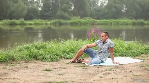 Viktoria Sweet relaxing outdoors by river in checkered shirt shorts