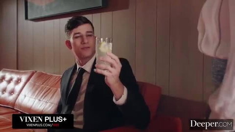 Ellie Nova in suit holding drink, tied up BDSM tease