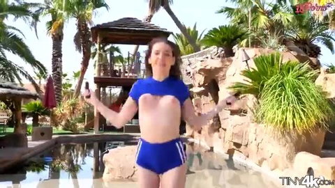 Naomi Blue in skimpy blue Adidas bikini jumping poolside outdoors