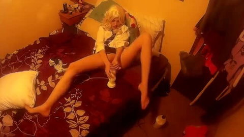 Annabelle Bestia blonde spreads legs holding toy on bed