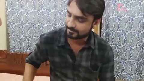 Desi Indian man in hotel room, shirt open, intense gaze