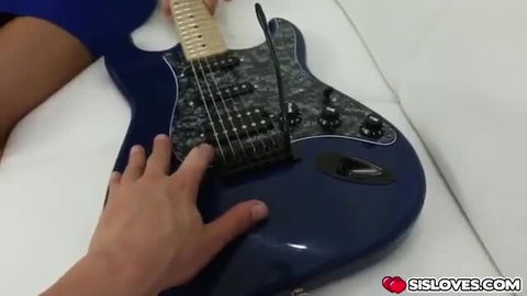 Ally Tate playing with hard cock on blue guitar