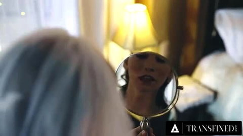 Dakota Skye stares in mirror with Korra Del Rio in Transfixed runaway bride scene