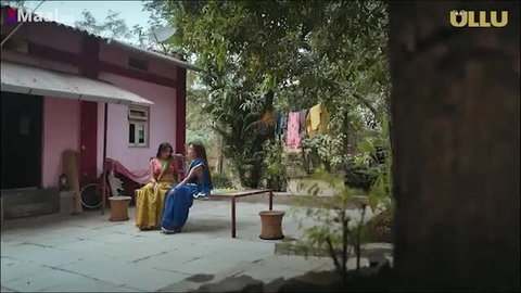 Two sumptuous Indian MILFs in colorful sarees chatting outdoors