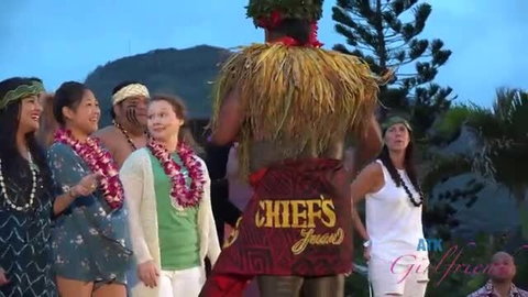 Polynesian hula dancers in grass skirts at outdoor Chiefs party