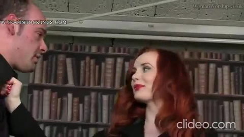 Miss Morrigan redhead in stockings kissed by man in library