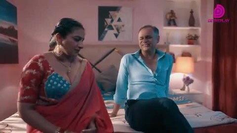 Indian BBW MILF in red saree with deep cleavage on bed