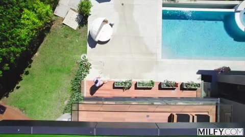 Paris Lincoln by luxury pool in skimpy white swimsuit, perfect MILF ass