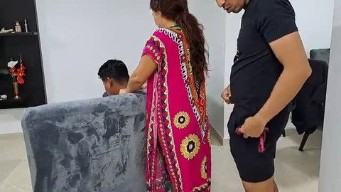 Cheating Indian wife in colorful dress grabs boyfriend's cock at gray sofa