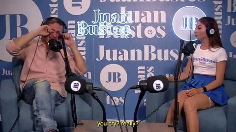 Petite Latina Juanan Bustos in sexy skirt on podcast interview