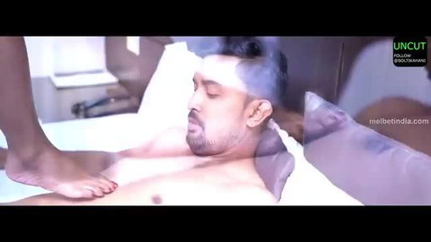Indian woman foot dominates nude man's chest in steamy bedroom tease