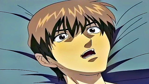 Surprised anime youth with wide eyes lying on bed in adult scene