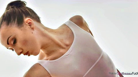 Jessi Empera petite ballerina in white leotard, arched flexible pose