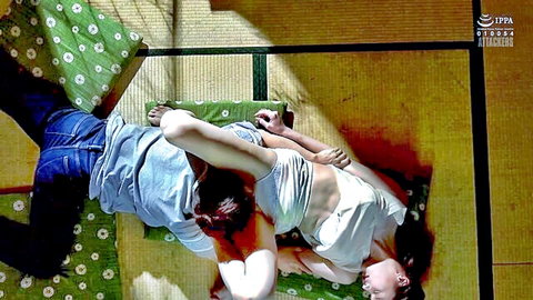 Japanese couple in intimate embrace on tatami, woman in white top