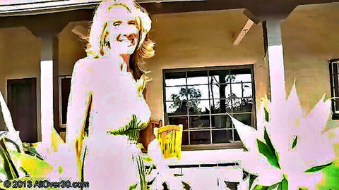 Blonde MILF in sheer white dress flashing huge tits outdoors in sunny garden