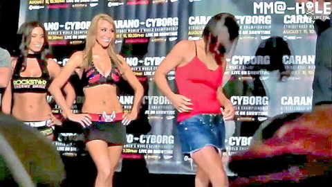 Gina Carano sexy body shots with fit MMA fighters in revealing outfits