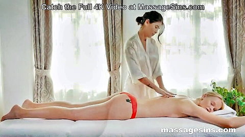 Lady Dee receiving sensual back massage topless in red panties