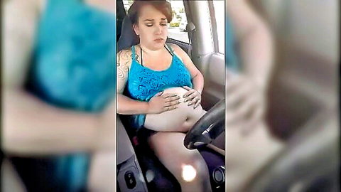 Pregnant brunette in blue bikini top relaxing in car seat