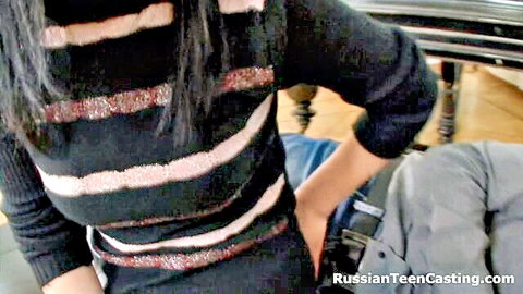 Russian teen in striped sweater on man's lap during amateur casting