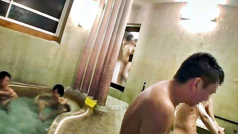 Nude Asian men in steamy Japanese onsen bathhouse