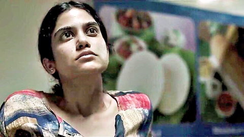 Indian girl in colorful dress teasing waiter in web series scene
