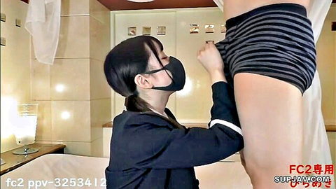 Masked Japanese schoolgirl in uniform groping man's bulge