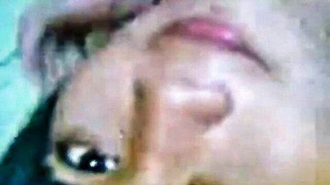 Close-up of seductive Indonesian model Lia's face, amateur adult video thumbnail