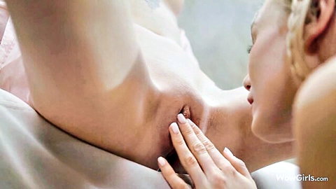 Skinny blonde lesbians intimately caressing neck during steamy facesitting foreplay