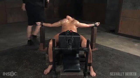 Alyssa Lynn restrains bound man on fucking machine in BDSM dungeon