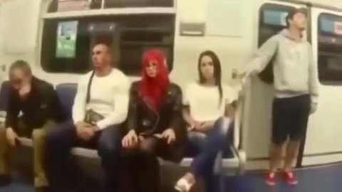 Desi couple on crowded metro with redhead goth girl and brunette
